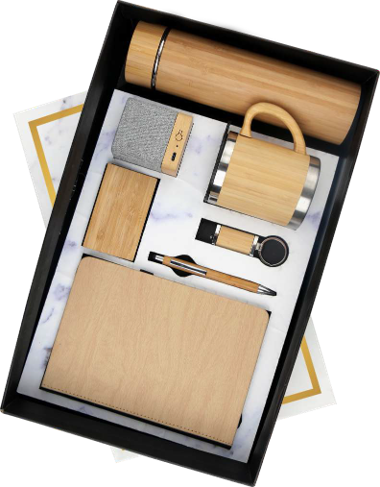 a wooden hamper in a box which have a dairy, pen, a cup and a bamboo bottle