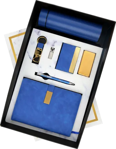 a blue gift hamper in a box which have a dairy, pen and a bottle
